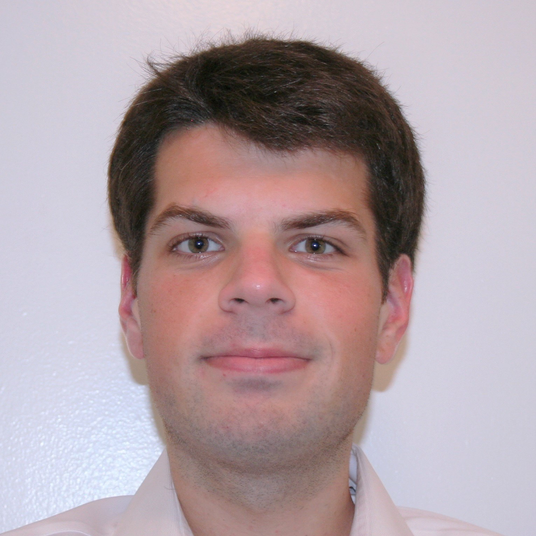 headshot of white man with short brown hair